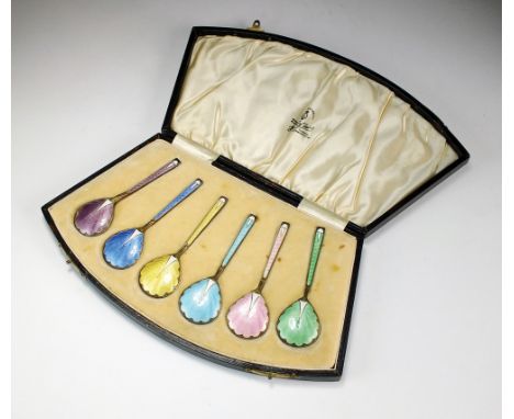 A cased set of six silver gilt and enamel spoons, Turner & Simpson, Birmingham 1929, each with engine turned enamel decoratio