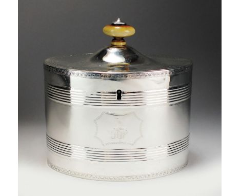 A George III silver tea caddy, Henry Chawner, London 1789, of oval form with two reeded bands to the body and central engrave