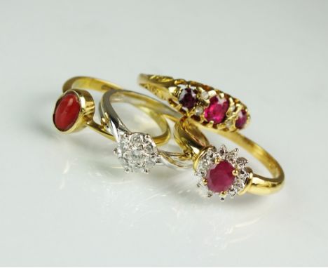 A seven stone ruby and diamond ring, together with an 18ct gold ruby and diamond oval cluster ring, a diamond floral cluster 