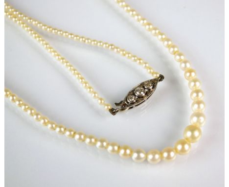 A graduated untested pearl necklace, with navette shaped diamond set clasp, the untested pearls measure from approx 2mm to 5.