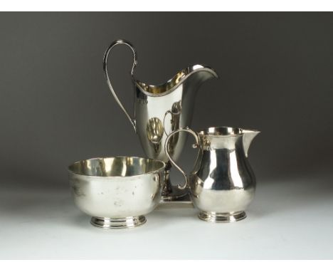 A silver sugar bowl and cream jug, Charles Stuart Harris & Sons, London 1904 & 1906, together with a helmet cream jug, London