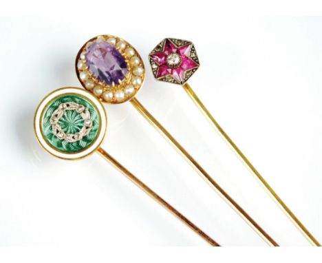 An early 20th century green and white enamel diamond set stick pin, together with a synthetic ruby and diamond set stick pin 