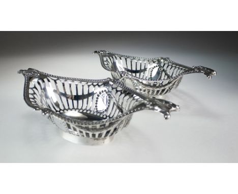 A pair of Edwardian silver bon bon dishes, William Hutton & Sons Ltd, London 1902, each of pierced navette form with beaded r