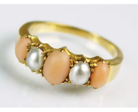 A five stone graduated coral and split pearl ring, designed as three oval cabochon corals interspersed with two split pearls,