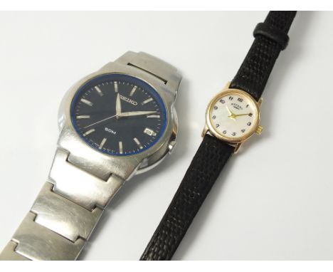 A Lady's 9ct gold wristwatch, the mother of pearl dial with Arabic numerals, quartz movement, with attached black leather str