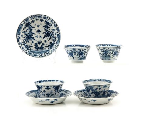 Including 4 cups and 3 saucers, blue and white floral decor, saucers are 13 cm. in diameter, chip on stand ring.