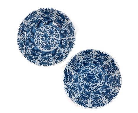 Floral decor, marked with double ring and flower, 21 cm. in diameter, chip.