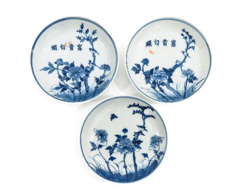 Depicting scenes in garden with flowers and Chinese text, Kangxi mark on bottom, 14 cm. in diameter.