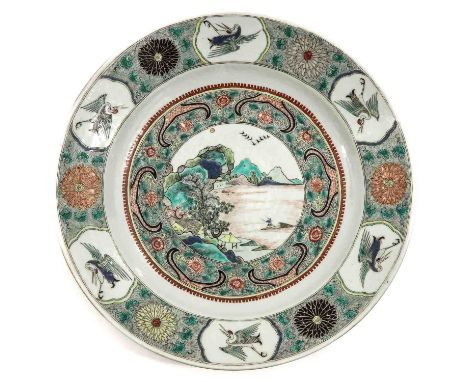 Decorated with landscape in center of charger, surrounded by desing of cranes and flowers on border, marked with double ring 