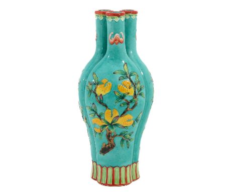 Light green ground decorated with bats and peaches in Famille Rose enamels, Qianlong mark, 25 cm. tall. 
