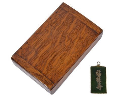 A Chinese Jade Pendant:
With applied Chinese characters to the centre, with gilt rope edge setting for pendant.
40mm x 21mm