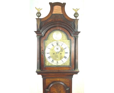 A George III Mahogany Longcase Clock: 
William Garrett, London
The brass arched dial with Roman numeral chapter ring and oute