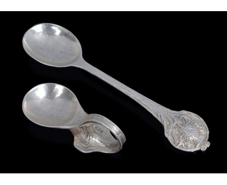 A Stylish Arts & Crafts Caddy Spoon by Ramsden & Carr, London 1913:
The ovoid bowl rests on the incorporated sinuous hoop han