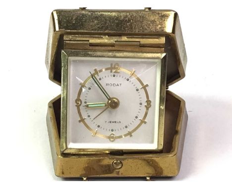 VINTAGE RODAT TRAVEL TIMEPIECE, MID 20TH CENTURY  modelled in the form of a handbag, in brass with black lacquer8cm wide 
