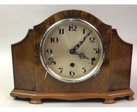 MANTEL CLOCK, EARLY 20TH CENTURY  the silverised dial with Roman numerals, cased in walnut 24cm high