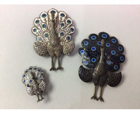 TWO SIAM SILVER AND ENAMEL PEACOCK BROOCHES ALONG WITH OTHER JEWELLERY including a pair of earrings