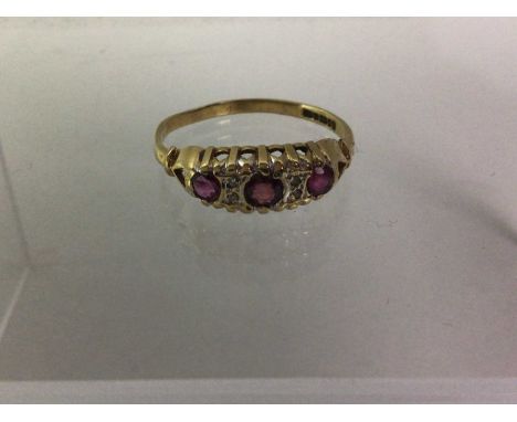 RUBY AND DIAMOND RING, set with three rubies flanked by four diamonds, in nine carat gold