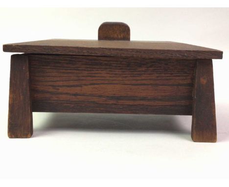 OAK CIGAR BOX ARTS & CRAFTS DESIGN with detachable cover, on tapering legs and a wooden three branch candlestick25cm wideQty:
