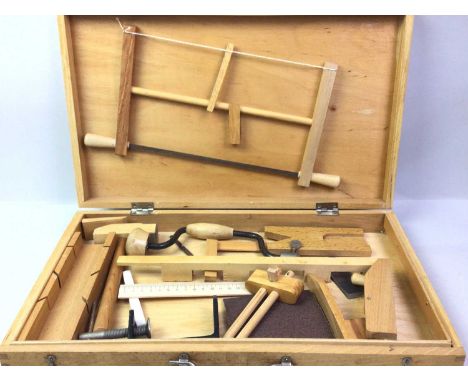 CHILD'S CARPENTRY TOOL SET, in a wood carry casethe case measures 44cm x 26.5cm