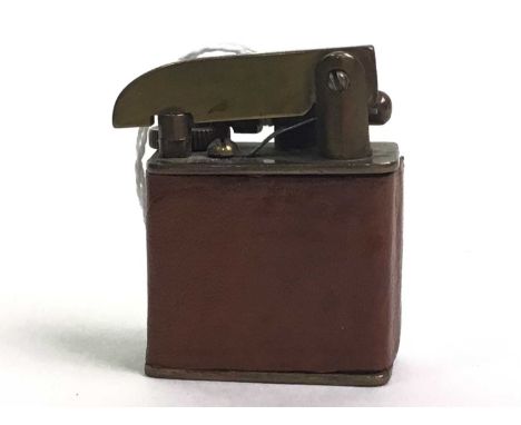WWI BRASS LIGHTER, with later brown leather cover5 cm highFurther images now online