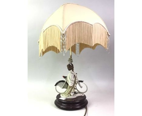 FLORENCE RESIN FIGURE LAMP, modelled with a lady and bicycle, with shade67cm high overall 