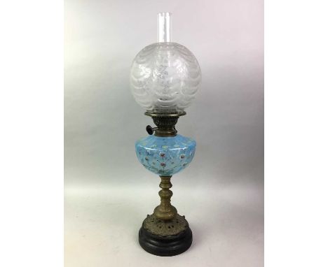 VICTORIAN OIL LAMP, with clear chimney, angraved shade and an enamelled blue vaseline glass reservoir over a brass column65cm