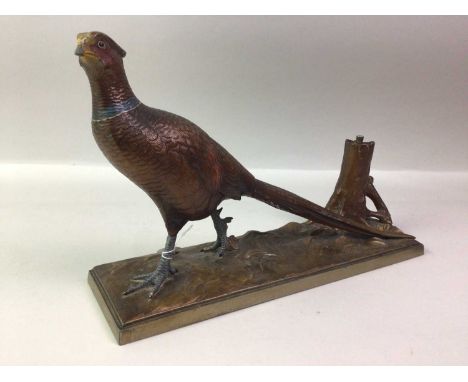 COLD PAINTED METAL TABLE LIGHTER, EARLY 20TH CENTURY  modelled as a standing pheasant next to a tree stump, with striker31cm 