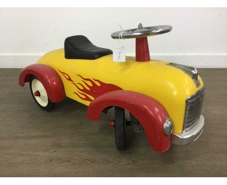 VINTAGE CHILD'S RIDE ON TOY CAR, ALONG WITH A MODEL MILITARY AEROPLANE the toy car painted in yellow with red flame and red w