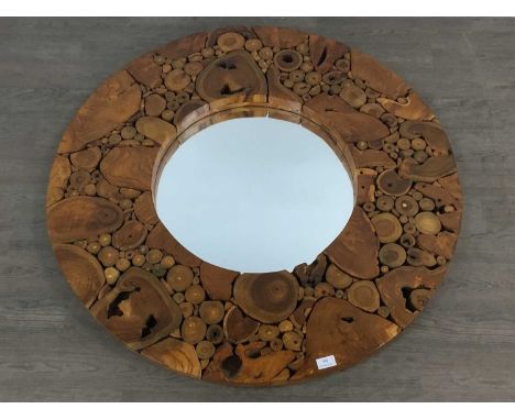 CONTEMPORARY WOODWORK WALL MIRROR, of circular form, the frame constructed from sectional tree trunk and branch cuttings99cm 