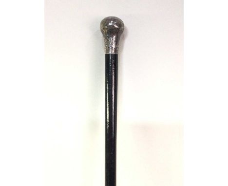SILVER TOPPED EBONISED WALKING CANE, the top decorated with scrolls and foliate designs