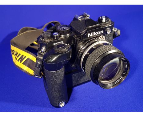 VINTAGE BLACK NIKON FMZN 35MM SLR FILM CAMERA WITH A NIKON 85MM 1:2 LENSE & NIKON MD-12 MOTOR DRIVE