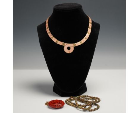 Group of three vintage necklaces, each with unique styling. Includes one articulated collar necklace with blush pink guilloch