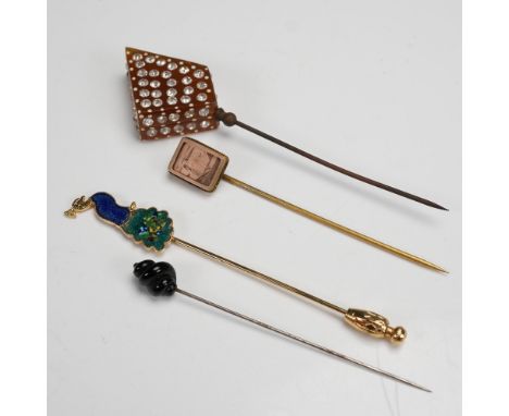 A charming collection of five vintage hat pins, each featuring a unique and eye catching design. The group includes a large t