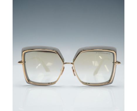 DITA Narcissus sunglasses featuring a bold, square silhouette with a grey gradient front and gold-tone metal accents. The fra