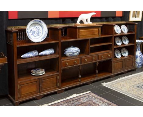 19th Cent. English library bookcase with a quite rare low model in mahogany with three drawers, five small doors and several 