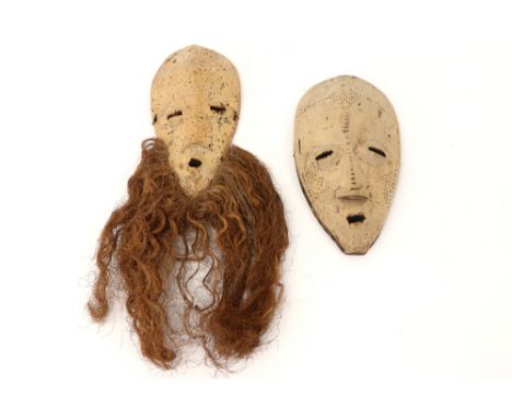 two masks from Sri Lanka in light wood prov : collection Prigogine - Brussels Mr. Yves Prigogine (son of the Nobel Price winn