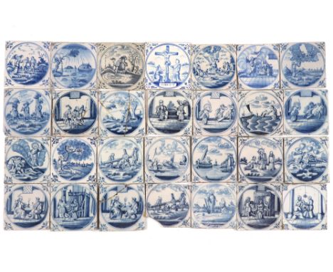 29pcs of 18th Cent. tiles in ceramic from Delft with blue-white decors, mostly with religious themes ||Lot van 29 achttiende 