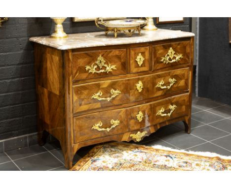 18th Cent. French Louis XV period chest of drawers in polished rose-wood with rich mountings in gilded bronze and with a marb