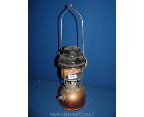 A glass/copper paraffin lamp.
