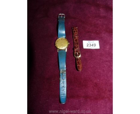 A Timex Shockproof gentleman's Wristwatch and a spare brown leather lady's strap