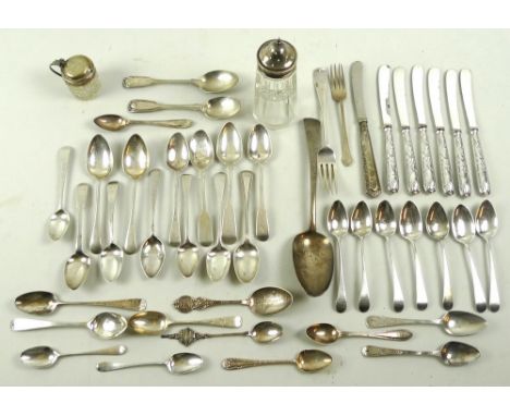 A collection of silver wares including Georgian and later spoons, further flatware, and a silver topped sugar shaker and must