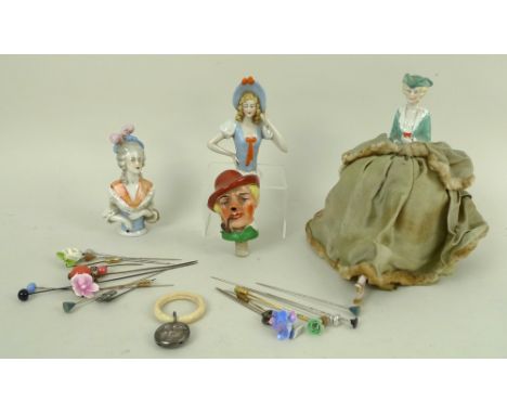 A group of Edwardian collectables, comprising an Edwardian hand painted porcelain half doll pin cushion, with feet, in a gree