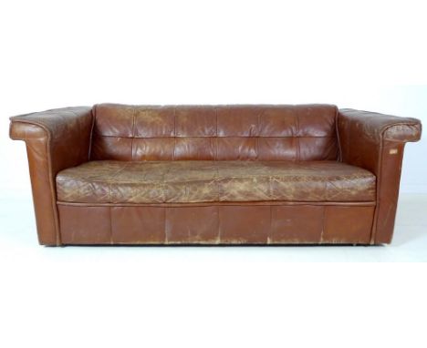 A vintage retro brown leather three seater sofa, with low back and sewn square patterned decoration, 200 by 90 by 70cm high.