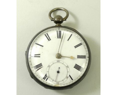 A Victorian silver cased pocket watch, key wind, white enamel dial with Roman numerals and subsidiary seconds dial, back of c