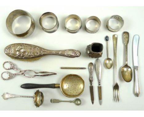 A group of mostly silver items including an ebony handled tea strainer, Birmingham 1916, two nail files, a pair of Continenta