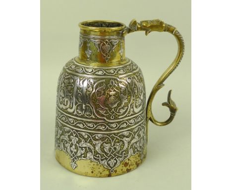 A 19th century silver inlaid brass Persian Islamic ewer, with continuous scrolling silver calligraphic characters, the handle