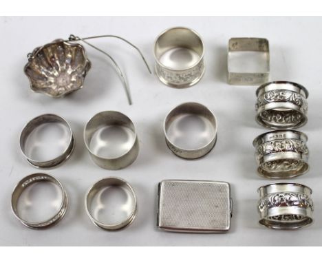 A collection of ten silver napkin rings including one set of three, various designs, makers and dates, together with a plated