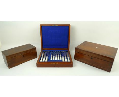 A mahogany cased set of dessert knives and forks, silver plated with mother of pearl handles, 11 forks and 12 knives, 29 by 2