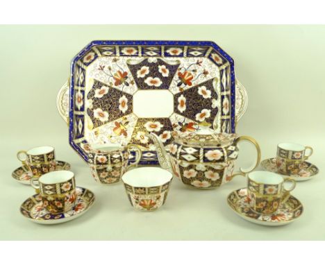 A Royal Crown Derby composite part tea service, in the Imari colourway, early 20th century, pattern 2451, comprising teapot, 