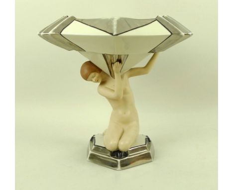 A Royal Dux Bohemia Art Deco porcelain centrepiece, modelled as a nude bather holding a fluted hexagonal diamond pointed bowl